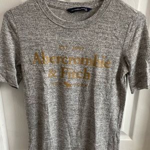 Grey T shirt with gold logo